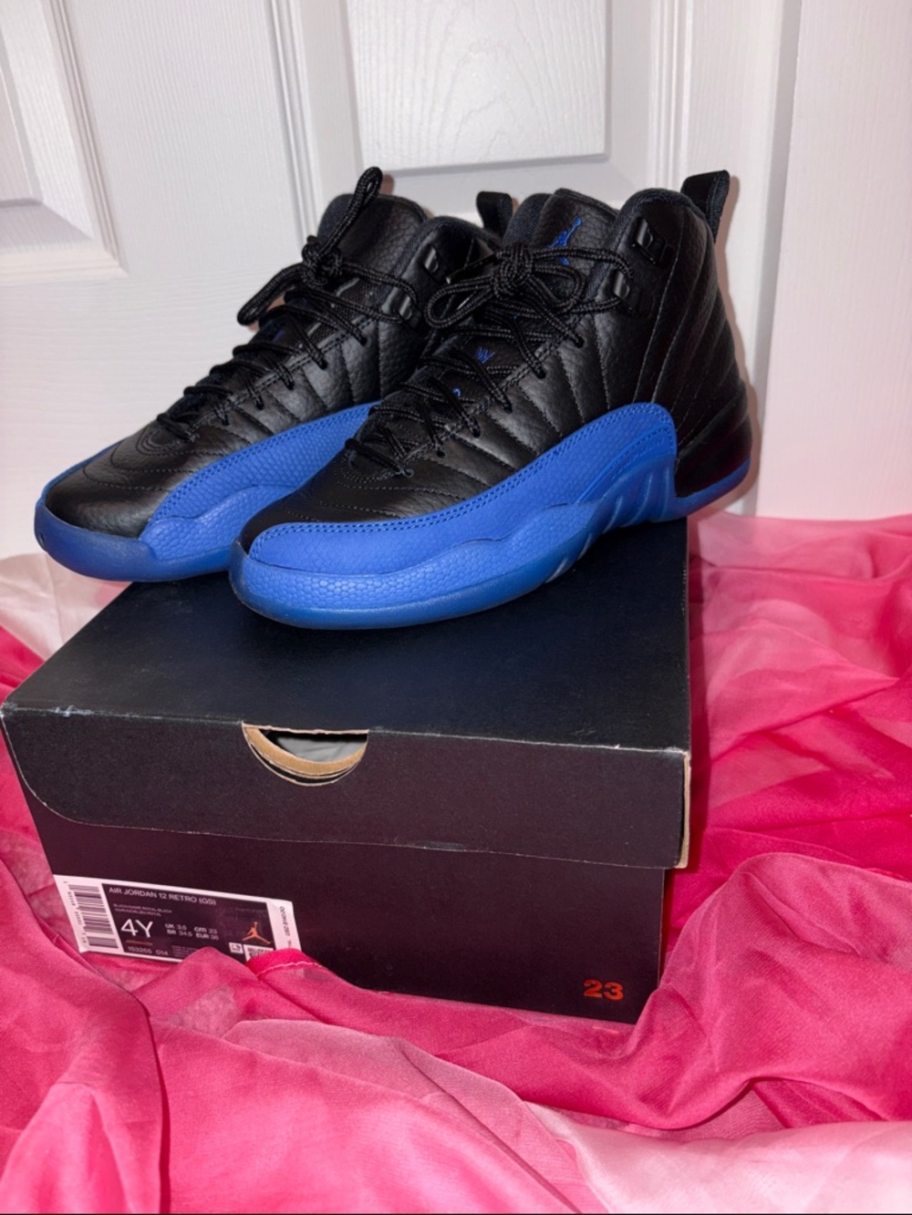 RETRO 12 BLACK AND BLUE JORDANS size 4Y Kids